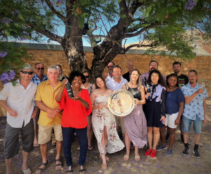 The 2021 Trophy Winners shade under a tree